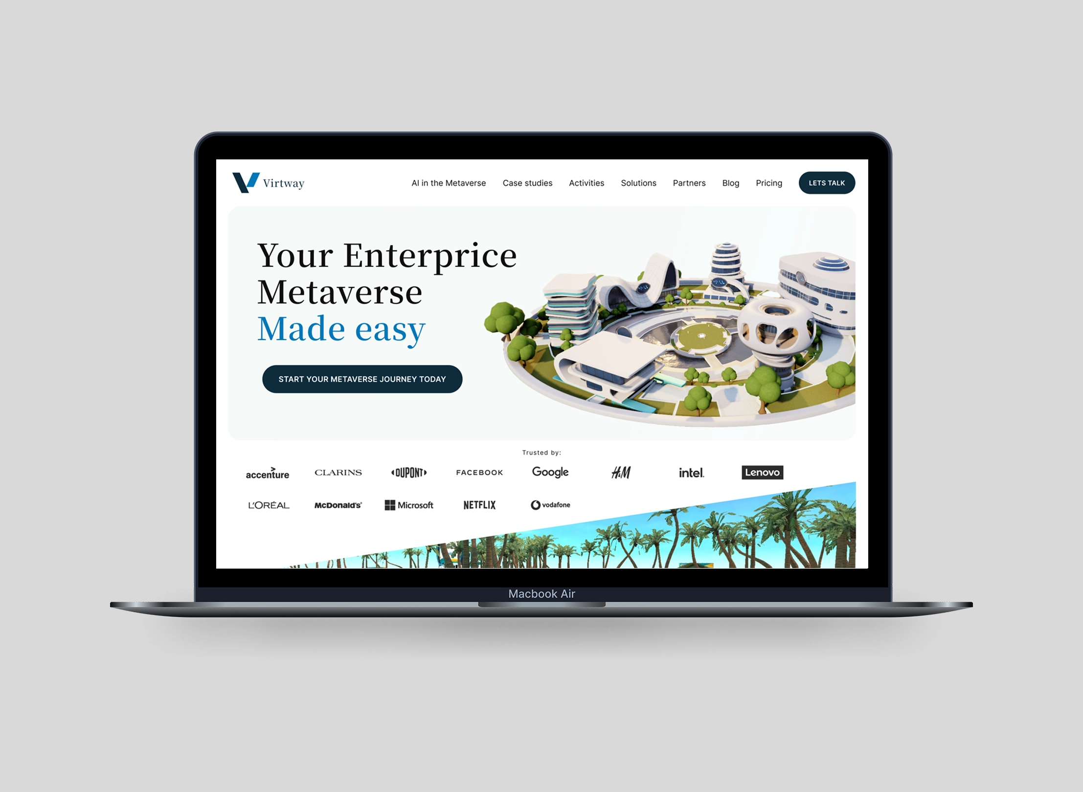MacBook Air displaying Virtway website with headline 'Your Enterprise Metaverse Made easy' and a 3D futuristic city model.
